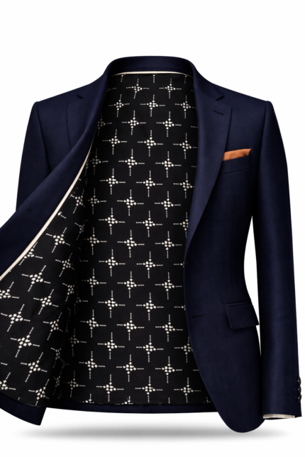 Men's navy blue suit jacket with premium patterned inner lining and pocket square, luxury tailored menswear.