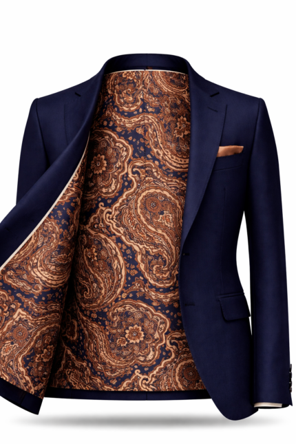 Men's navy blue suit jacket with paisley patterned inner lining and pocket square, premium luxury tailored menswear.